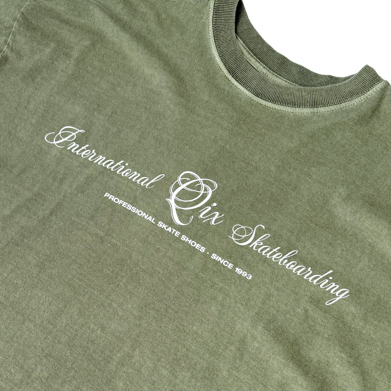 CAMISETA QIX BOX INTERNACIONAL SKATEBOARDS OLIVA ESTONADO